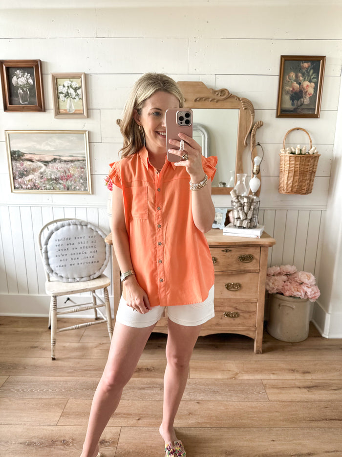 melon color button down top with flutter sleeves and front pocket 