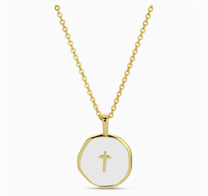Gold necklace with a white pendant featuring a cross on a white background
