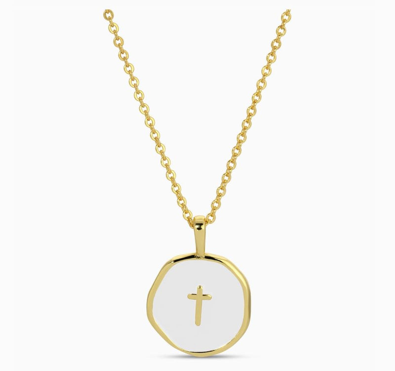 Gold necklace with a white pendant featuring a cross on a white background