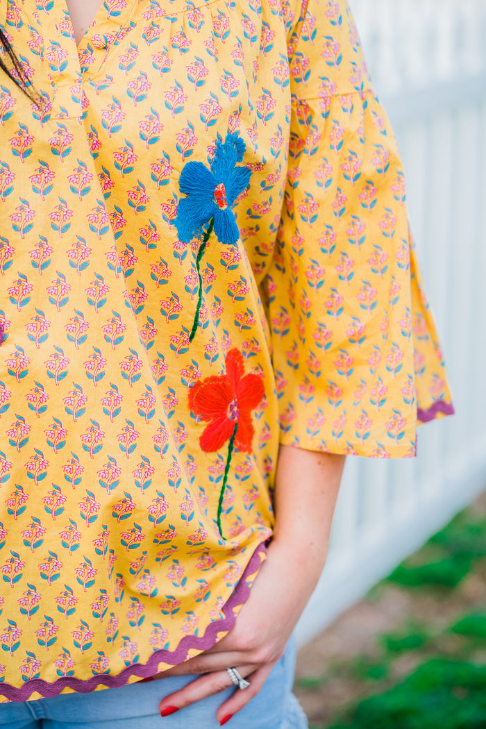 abigail top up close of embroidered flowers