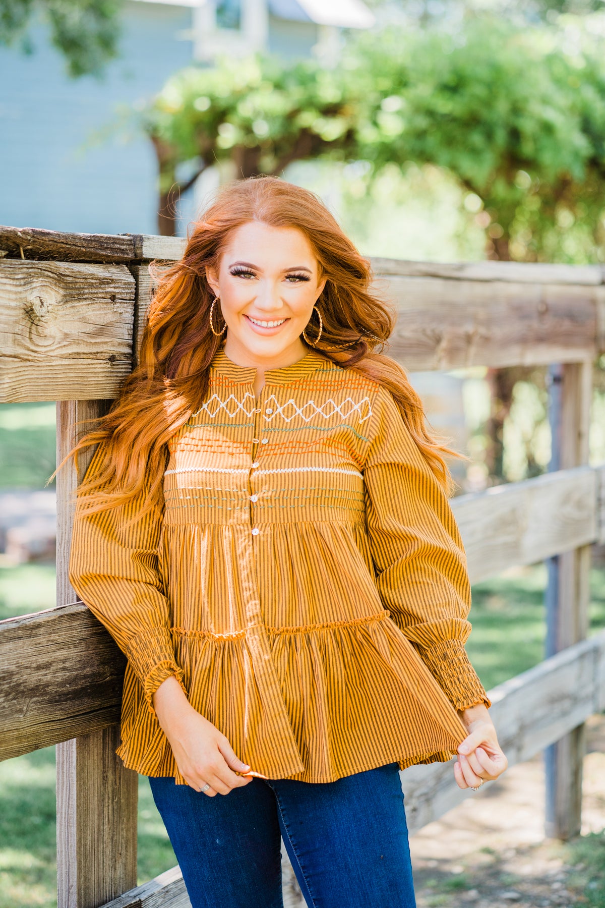 orange stripe button down flowy top with embroidered detaisl