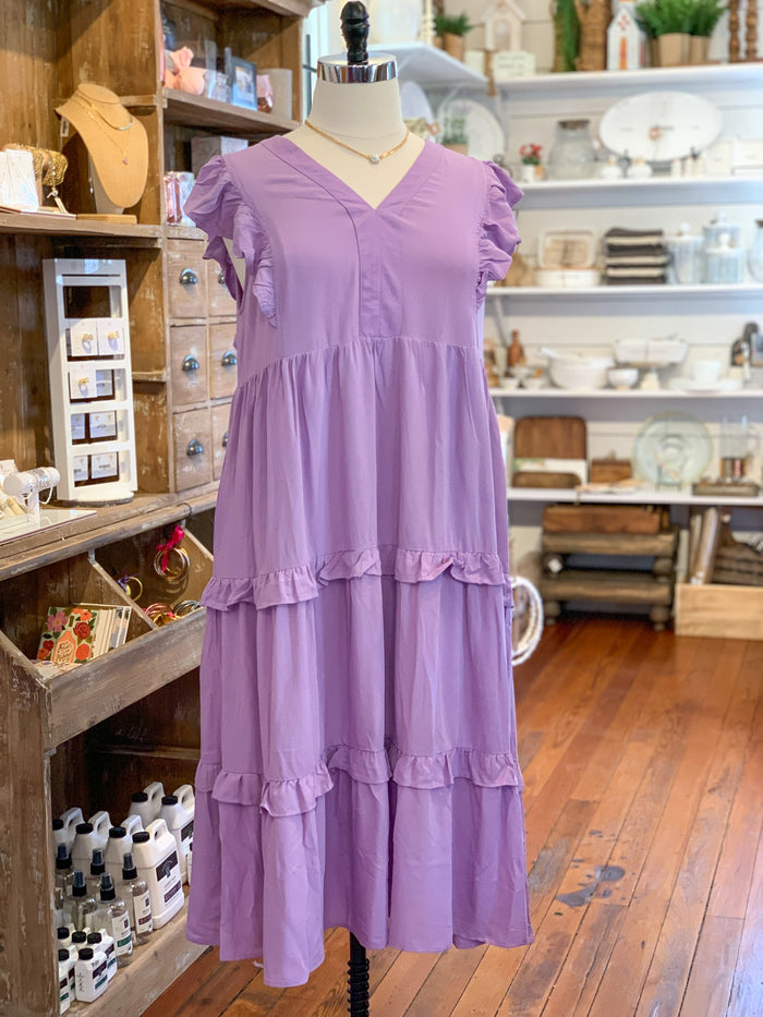 lavender color midi dress with layers and ruffles on the sleeves