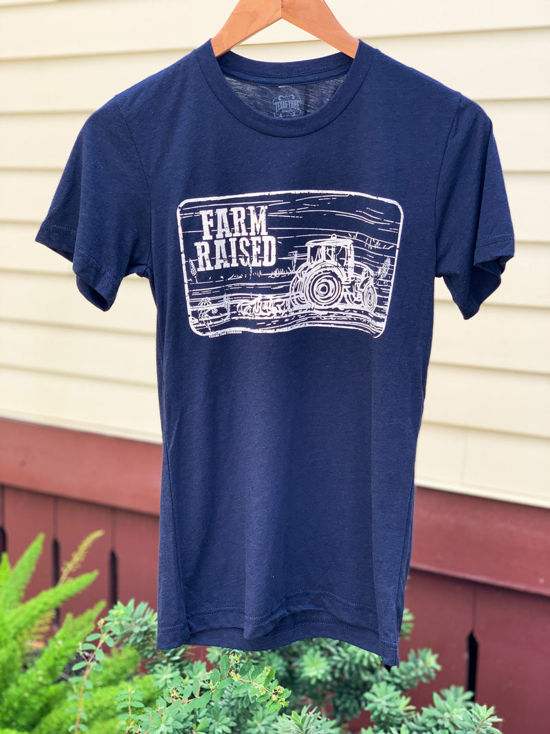 navy blue tee that says farm raised with tractor