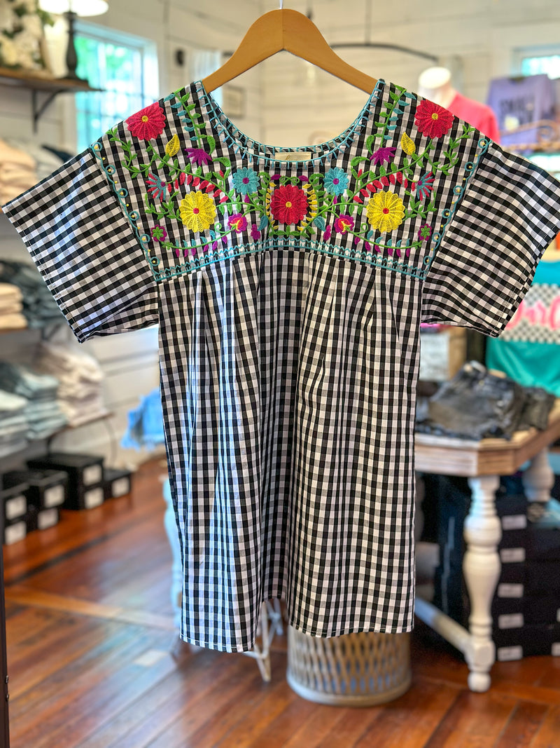black and white checkered top with colorful embroidered flowers