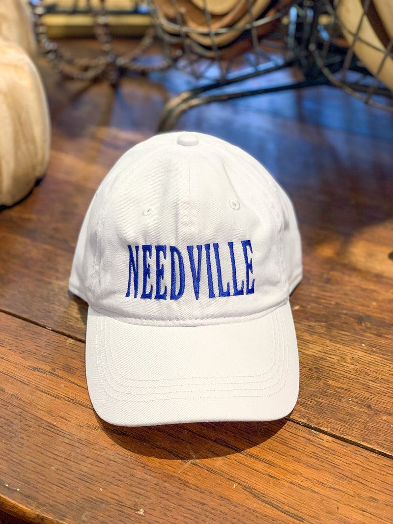 white needville cap with royal blue stiching