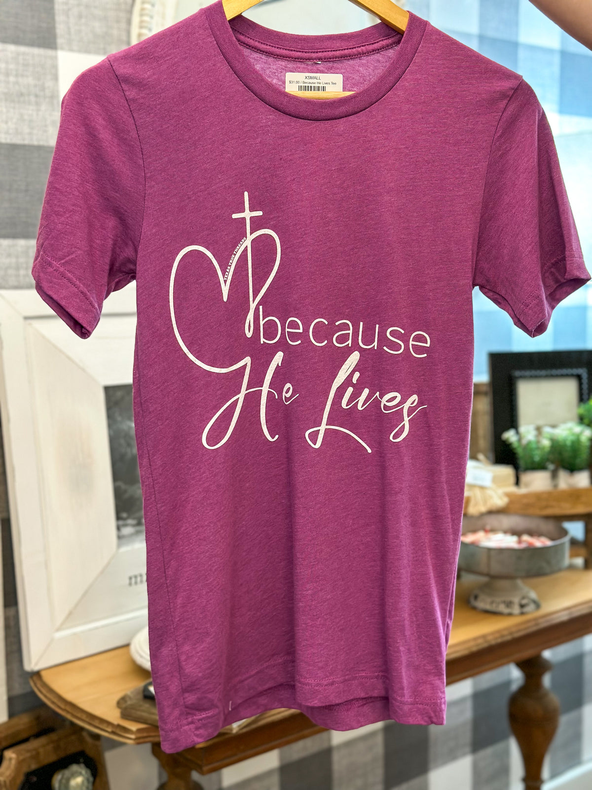 because he lives tee on magenta color tee texas true threads