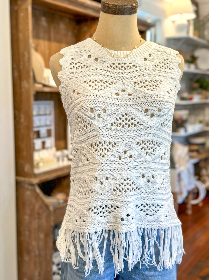 white crochet top with fringe hem