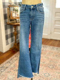 medium wash vervet crop flare with side slit and step hem