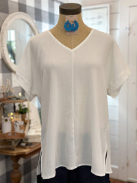 SOLID WHITE VNECK TOP SHORT SLEEVE ROLLED SLEEVES AND SIDE SLITS ON TOP COTTON BLEU